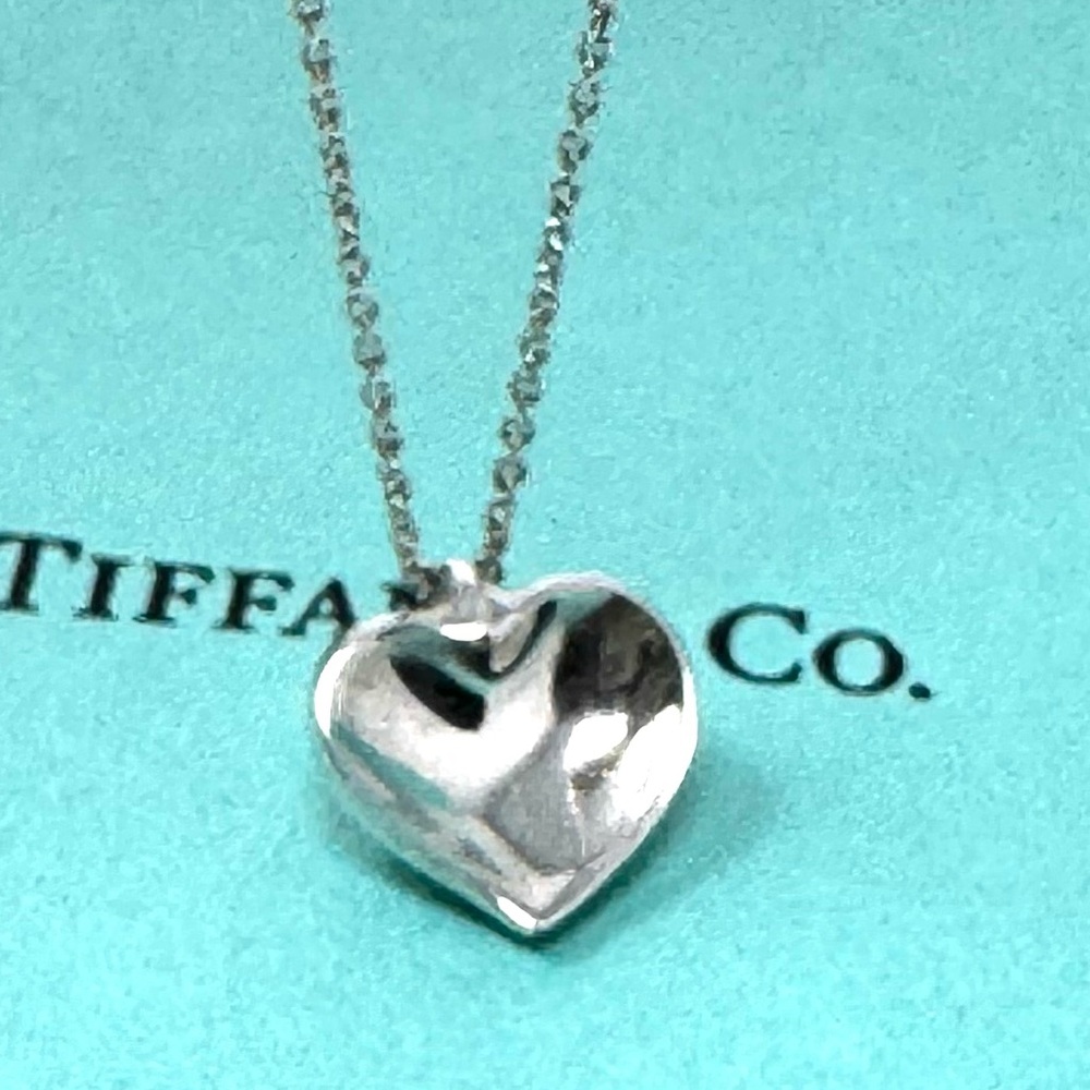 Authentic Tiffany & Co. Elsa Peretti Curved Heart Pendant Necklace.